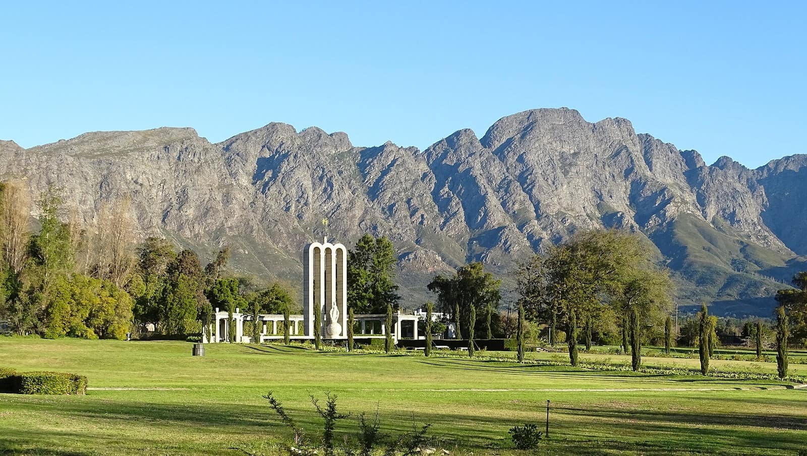 The Huguenot Monument in Franschhoek with the mountains behind