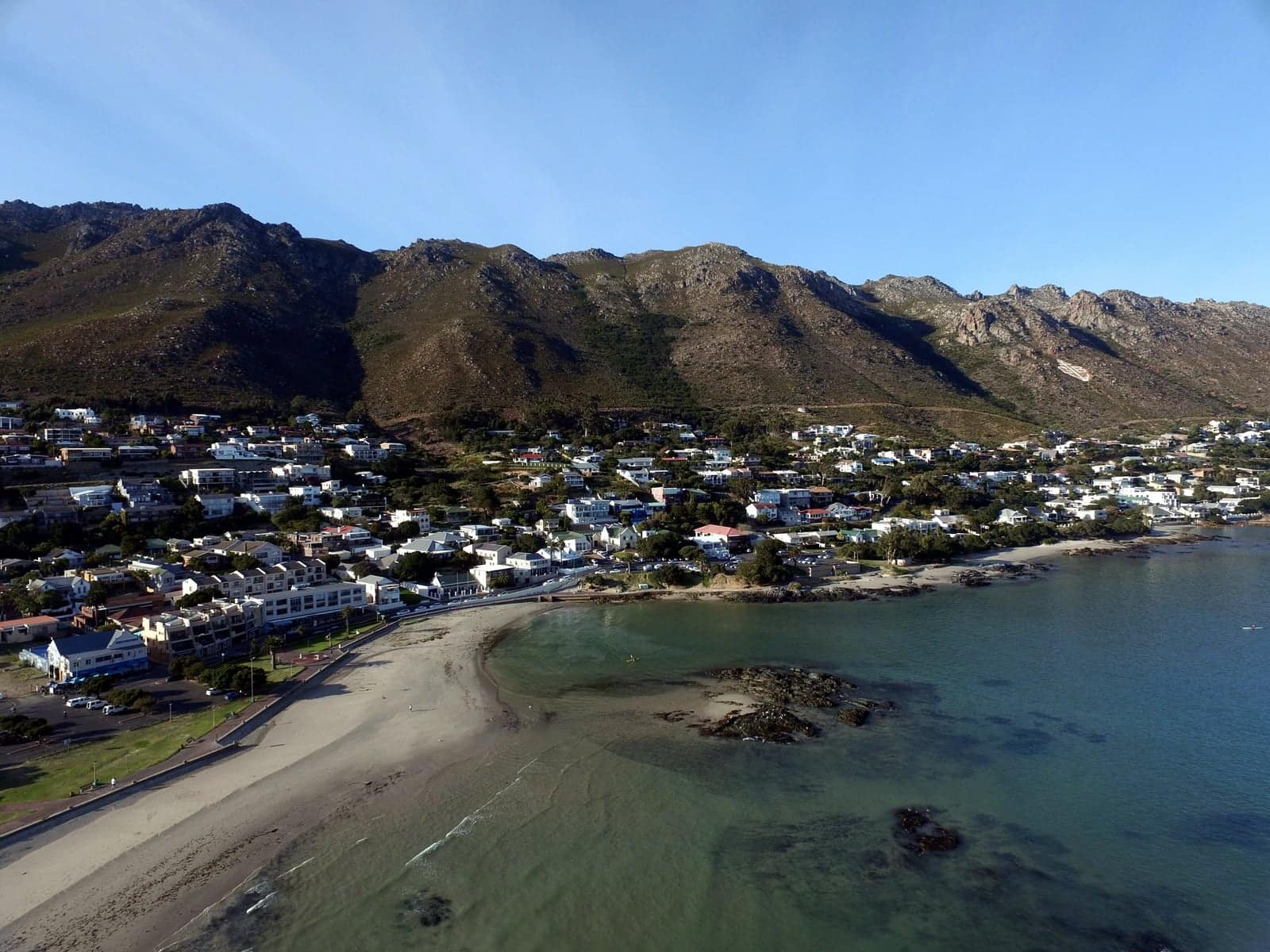 Gordon's Bay beach and rock pools below the Hottentots Holland mountains